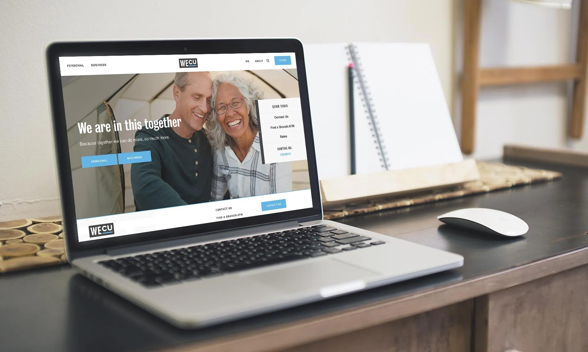 A laptop displaying a website with an elderly couple's image, set against the backdrop of a home office scene.