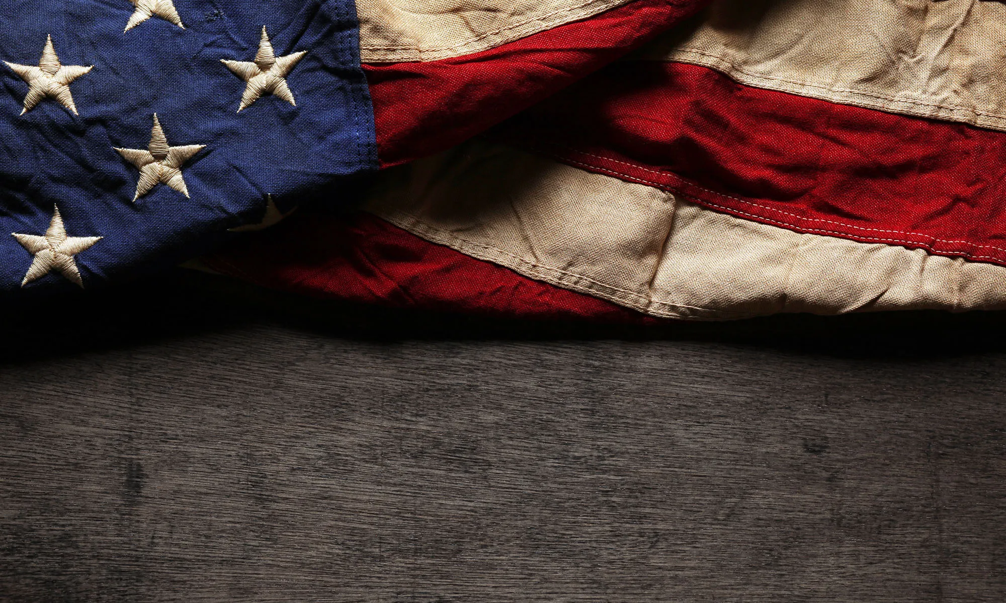 American flag on wooden table.