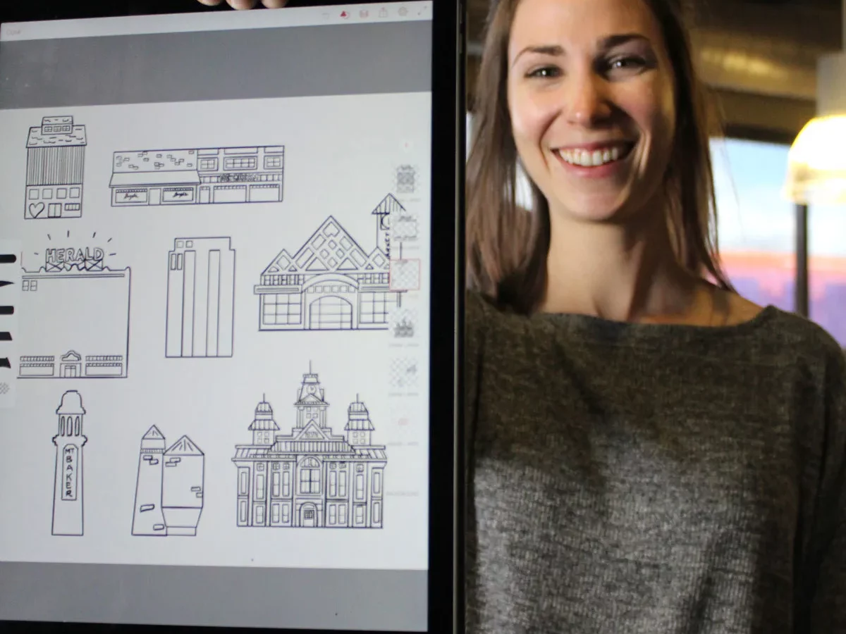 A woman holding a tablet displaying sketches of buildings and architectural designs.