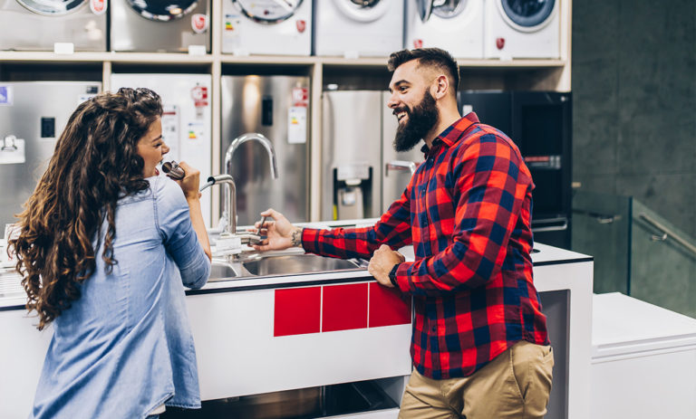 A man and a woman at a counter.