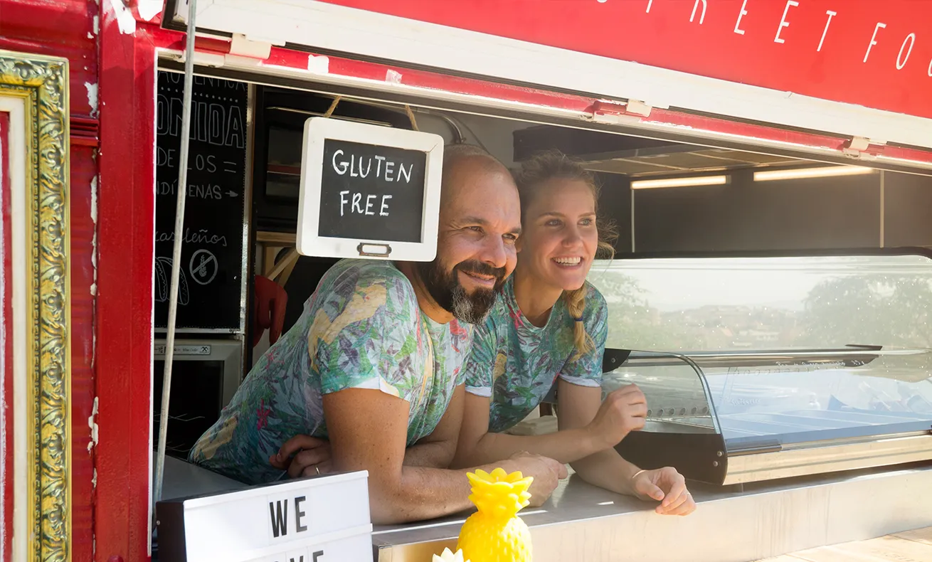 Two taco truck owners await their next customer.