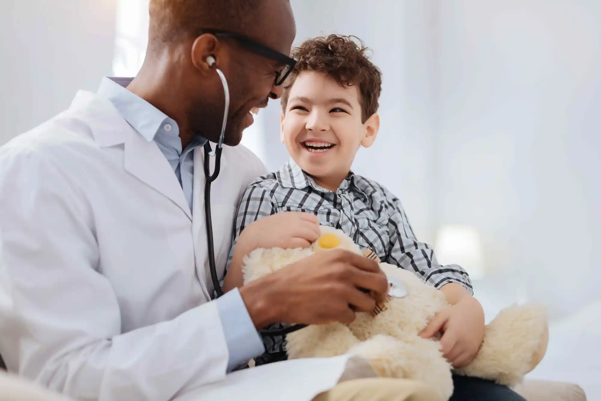 Doctor holding child's hand.