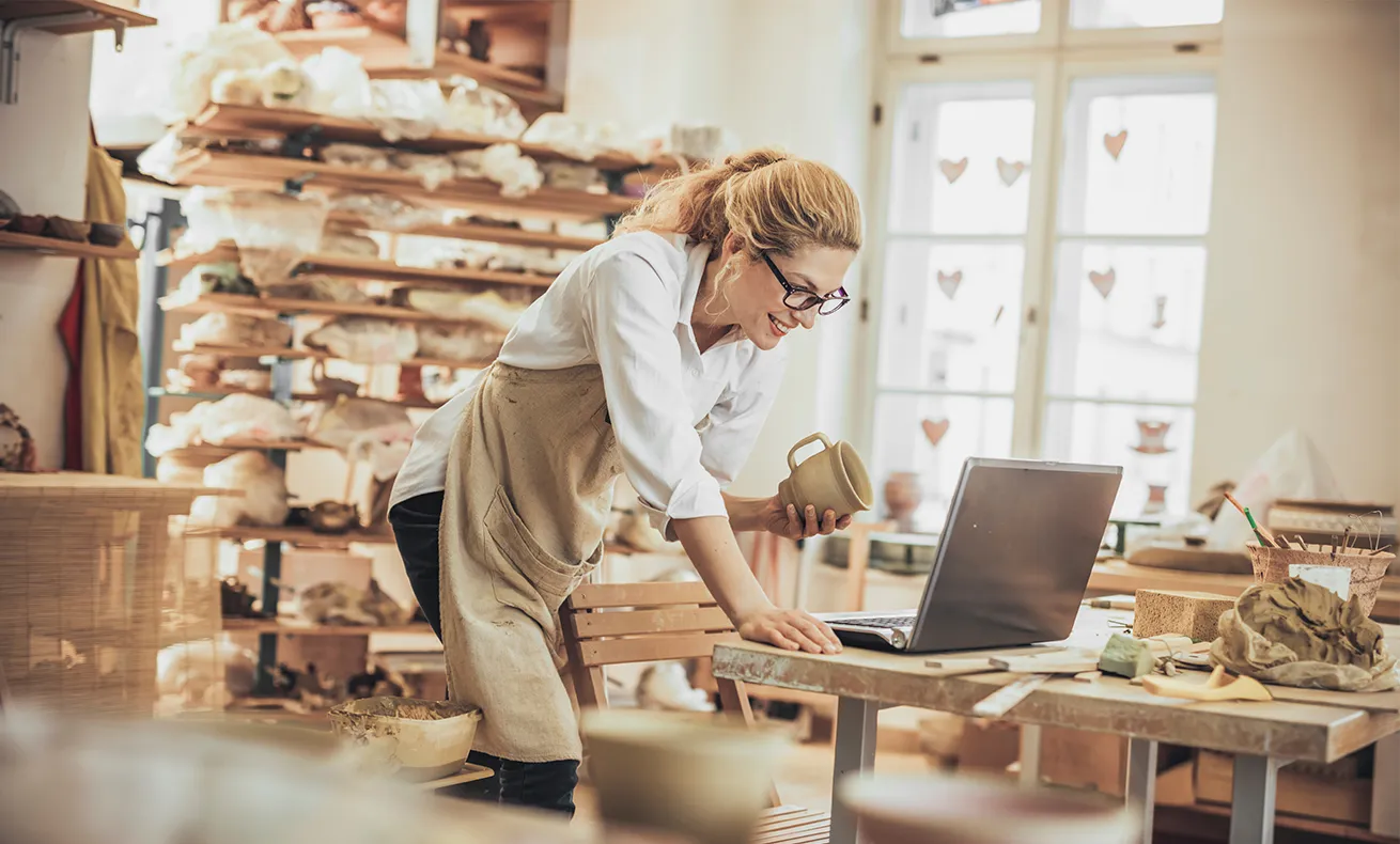 A bakery owner checks her laptop.
