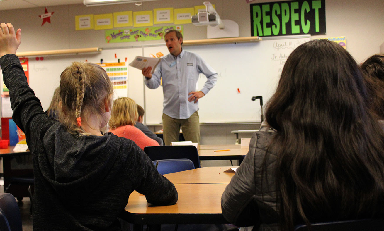Reid Frederick talking to a group of students in a classroom.