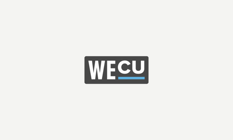 An abstract graphic with a minimalist design, featuring shades of grey and white, with the top half being light grey and the bottom half darker grey. There is a vertical strip in the middle dividing the two halves. On the right side, there's an icon resembling a letter 'W' with a smaller letter 'E' below it, and the letters are colored blue. The image has a logo-like appearance and contains text on top right corner that reads WECU.