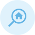 An icon featuring a magnifying glass pointing to a house symbol