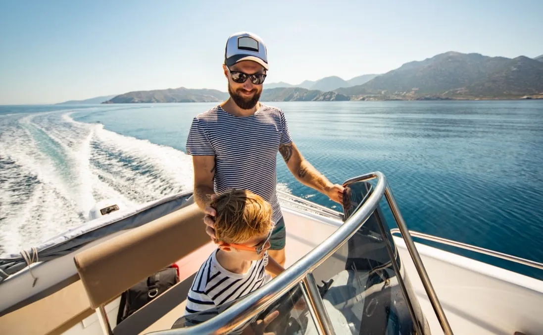 Father and son on a boat