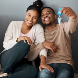 Couple taking a selfie with their house keys