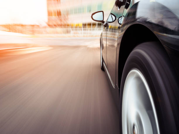 Blurred motion blur effect with a car in motion on a highway.