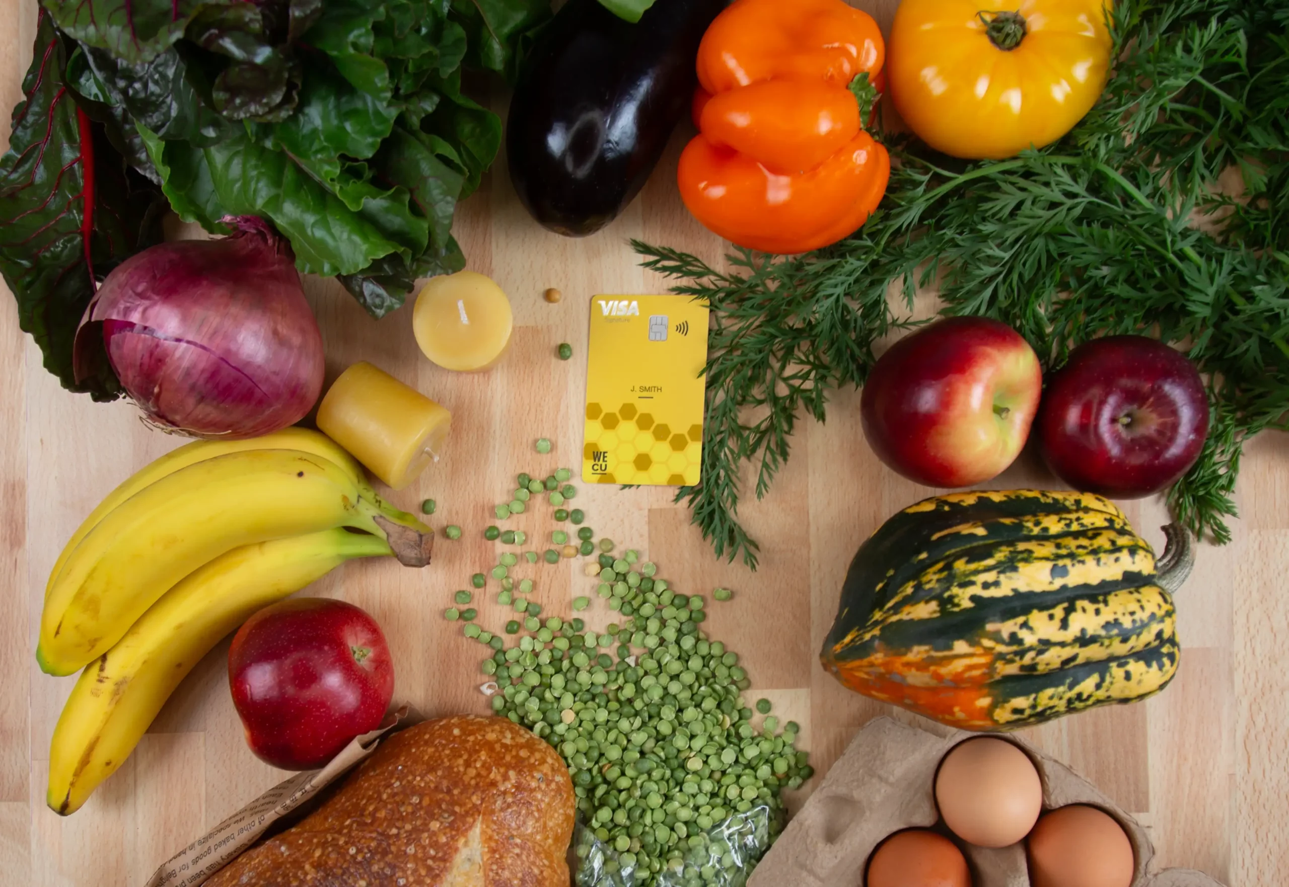 credit card surrounded by groceries