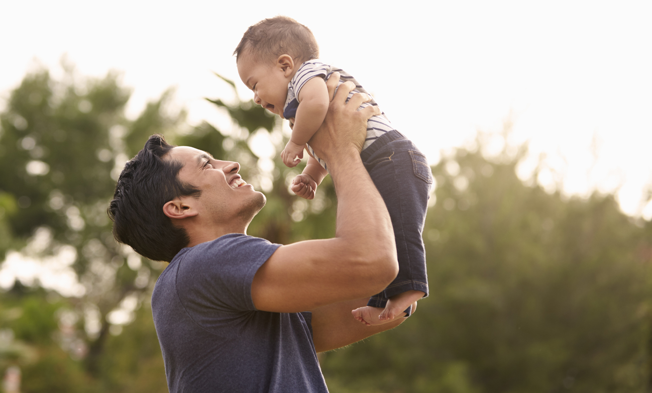 Person holding a baby.