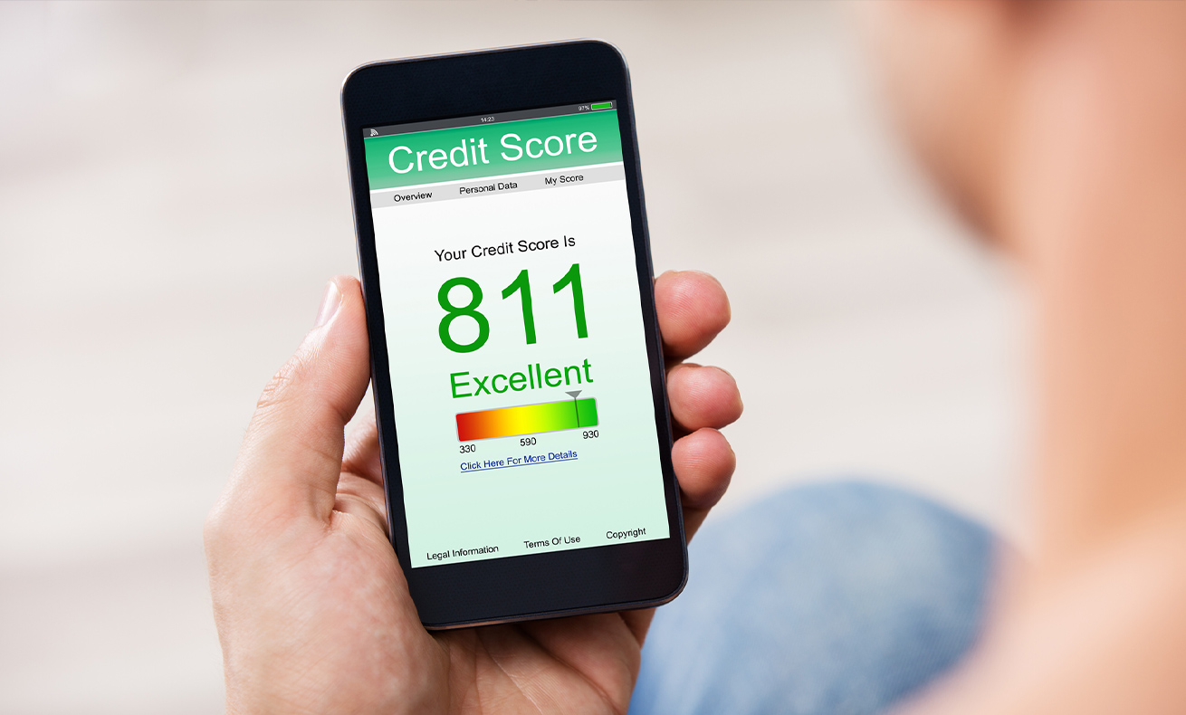 A person holding a smartphone displaying an app with a credit score and 81% approval rating.