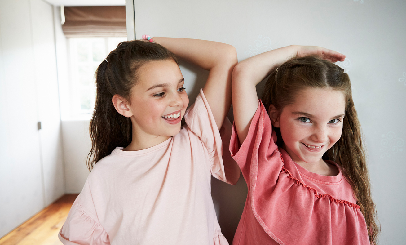 Girl and woman facing opposite directions.