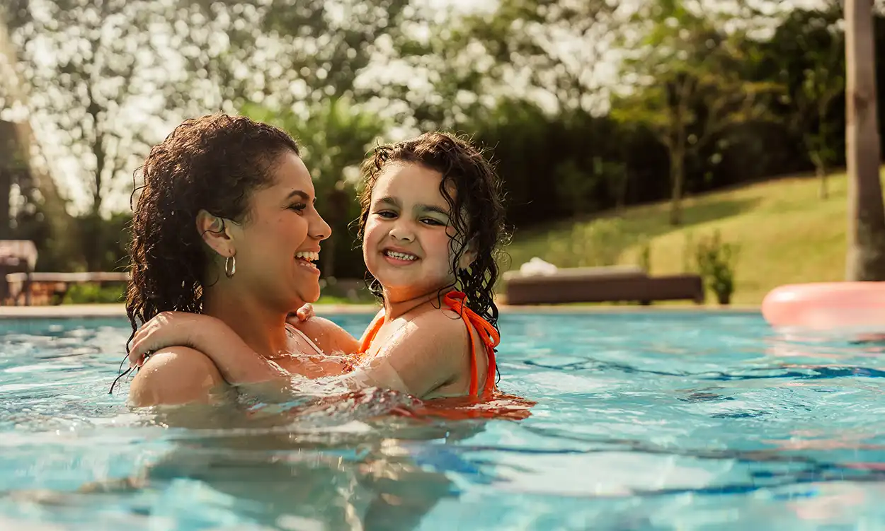 mom and toddler in pool