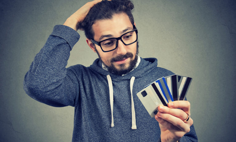 Person holding playing cards